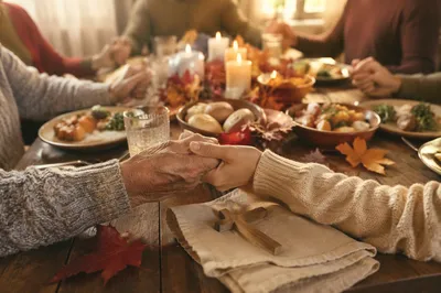 Thanksgiving Family Prayer at Farmhouse Table