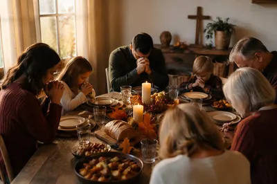 Thanksgiving Family Prayer at Rustic Dinner Table