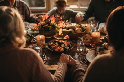 Thanksgiving Family Prayer at Rustic Dinner Table