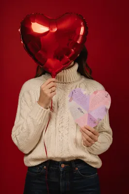 Person Holding Red Heart Balloon Portrait