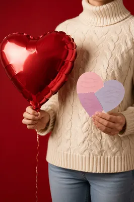 Person Holding Heart Balloon and Card