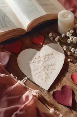 Heart Shaped Card Beside Open Bible