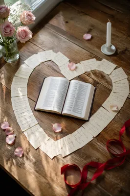 Heart Shaped Cards Around Open Bible