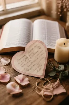 Valentine Heart Card Beside Open Bible