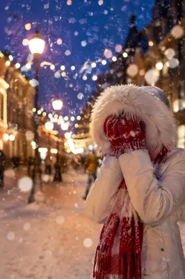 Cozy Winter Evening Under Snowy Street Lamps