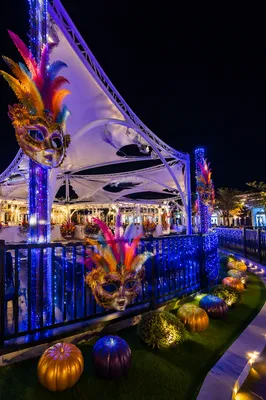 Festive Carnival Masks Under Glowing Canopies