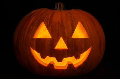 Glowing Carved Halloween Pumpkin Close-Up