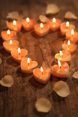 Heart Shaped Candles on Romantic Wood