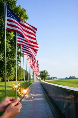 Patriotic Sparklers Along Flag-Lined Summer Walkway