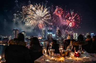 Rooftop New Year Fireworks Over City Skyline