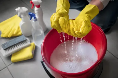 Spring Cleaning Supplies with Bucket and Gloves