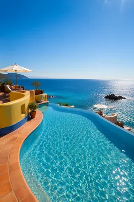 Sunny Resort Pool Overlooking Blue Ocean