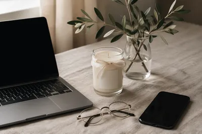 Minimalist Desk Setup with Candle and Plant