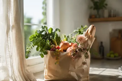 Sunlit Grocery Bag with Produce and Flowers