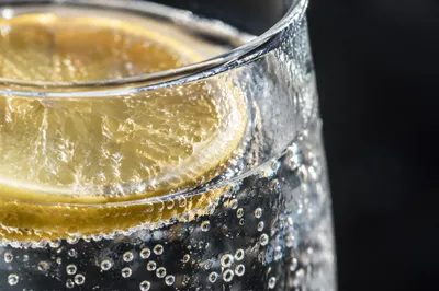 Sparkling Lemon Water in Sunlit Glass