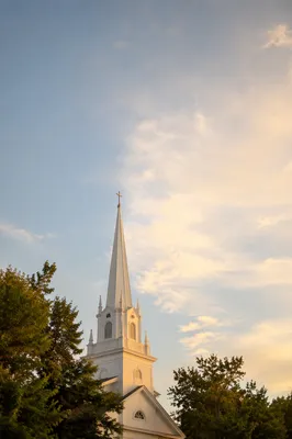 White Church Steeple at Sunrise Sky