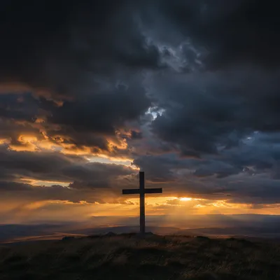 Silhouette Cross Beneath Dramatic Evening Sky