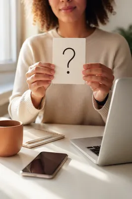Hands Holding Question Mark Card