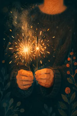 Hands Holding Sparklers at Night Celebration