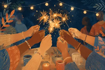 Joyful Hands Holding Sparklers at Night