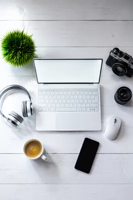 Clean Creative Workspace With Headphones and Coffee