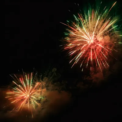 Colorful Fireworks Bursts in Night Sky