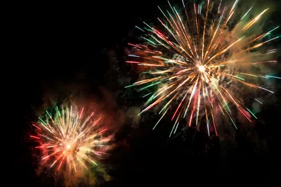 Colorful Fireworks Bursts in Night Sky