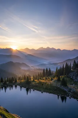 Panoramic Mountain Sunrise with Reflective Lake
