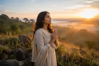 Young Woman Praying at Sunrise Meadow