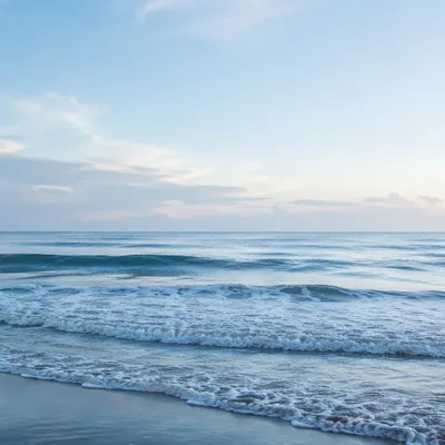 Calm Ocean Waves Under Morning Sky