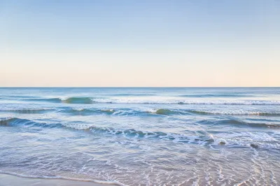 Calm Blue Ocean Waves at Sunrise