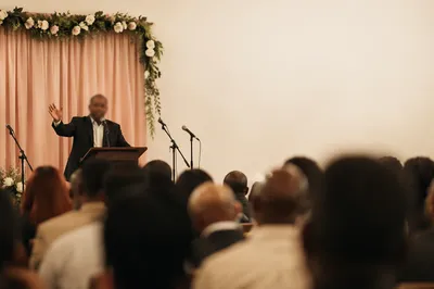 Preacher Speaking in Modest Worship Hall