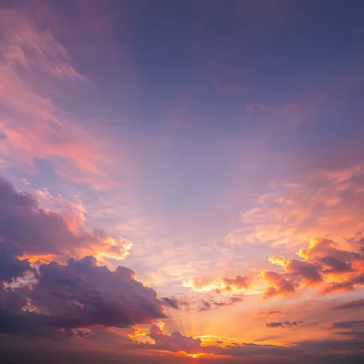 Dramatic Sunset Clouds Over Distant Horizon