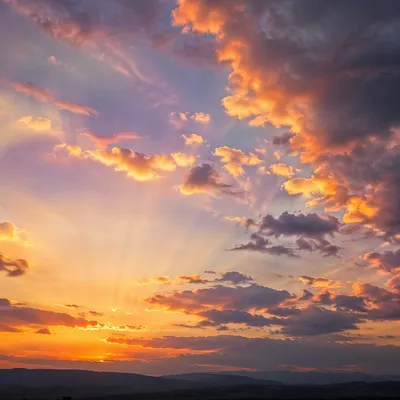 Dramatic Sunset Sky Over Distant Hills