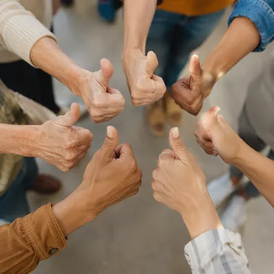 Diverse Hands Giving Thumbs Up Circle
