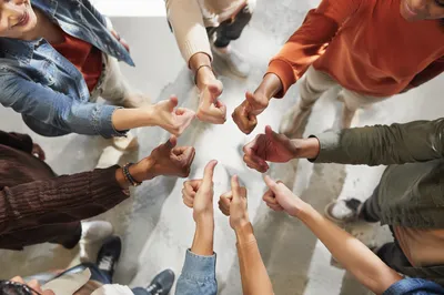Diverse Friends Giving Thumbs Up Together