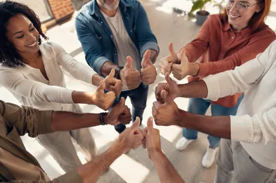 Diverse Friends Giving Thumbs Up Circle