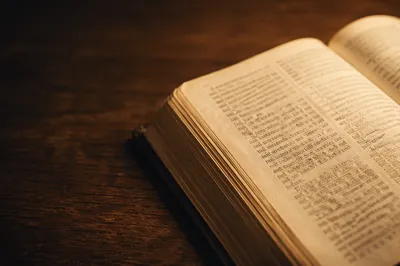Open Book on Dark Wooden Table