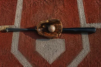 Baseball Gear on Home Plate Turf