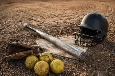 Baseball Gear Resting on Home Plate
