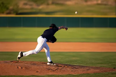Baseball Pitcher Release on Sunny Mound