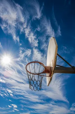 Outdoor Basketball Hoop Under Blue Sky