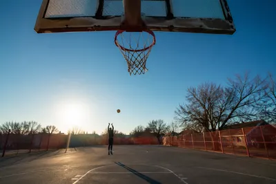 Sunny Neighborhood Basketball Court and Hoop