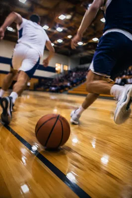 Indoor Basketball Action on Polished Gym Court