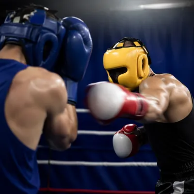 Intense Boxing Sparring in Gym Ring