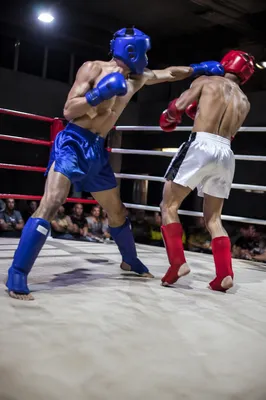 Gritty Boxing Sparring in Indoor Gym Ring