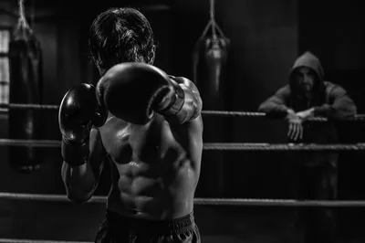 Gritty Boxer Training in Dim Gym