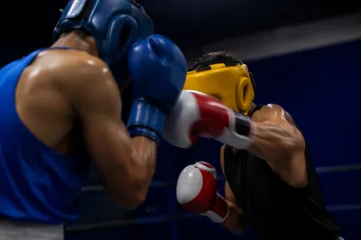 Intense Boxing Sparring in Gym Ring