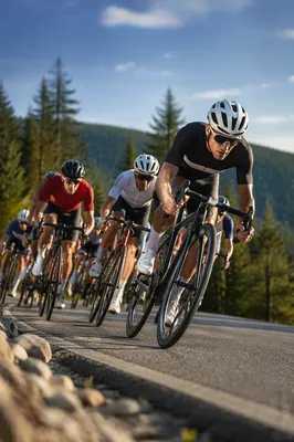 Road Cyclists Racing Uphill on Mountain Road