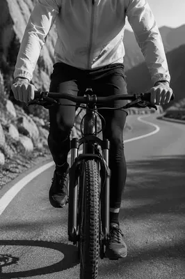 Cyclist Climbing Quiet Mountain Road
